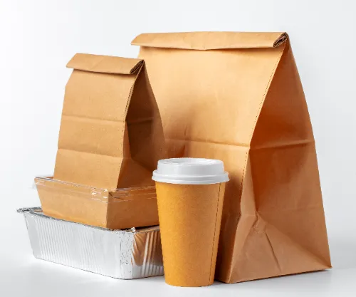 Set of recyclable food packaging on white background